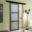 GD MENUISERIES - Porte Coulissante Gris Taupe RAL 7006 Vitee H204 x L73 cm, Rail Alu Bandeau noir, Coquilles - vignette