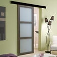 GD MENUISERIES - Porte Coulissante Gris Taupe RAL 7006 Vitrée H204 x L83 cm, Rail Alu Bandeau noir, Coquilles - vignette