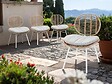 JARDILINE - Lot de 4 Chaises de jardin en résine tressée FLORES avec coussin chiné gris/beige - vignette