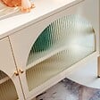 OVIALA - Meuble TV moderne 2 portes L115 cm en métal écru - Dreamy - vignette