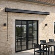 CONCEPT USINE - Store banne motorisé 395 x 3 m en aluminium avec toile gris LOZIO $ - vignette