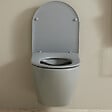GODART - Pack WC suspendu gain de place bâti mural verre noir + cuvette sans bride gris mat corolla - vignette