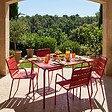 OVIALA - Ensemble table de jardin et 4 fauteuils en métal rouge - Palavas - vignette