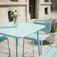 OVIALA - Ensemble table de bar et 4 chaises hautes en métal turquoise - Palavas - vignette