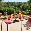 OVIALA - Table de jardin en acier 6 places 120 cm rouge  - Palavas - vignette