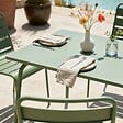 OVIALA - Ensemble table de jardin en métal et 4 chaises vert cactus - Palavas - vignette