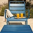 OVIALA - Fauteuil relax et repose pied en métal bleu pacific - Palavas - vignette