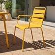 OVIALA - Ensemble table de jardin et 6 fauteuils en métal jaune - Palavas - vignette