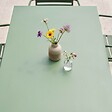 OVIALA - Ensemble table de jardin et 6 fauteuils en métal vert cactus - Palavas - vignette
