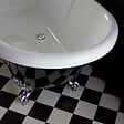 PLANETE BAIN - Baignoire îlot Charly noire avec pieds patte d'aigle chrome - vignette